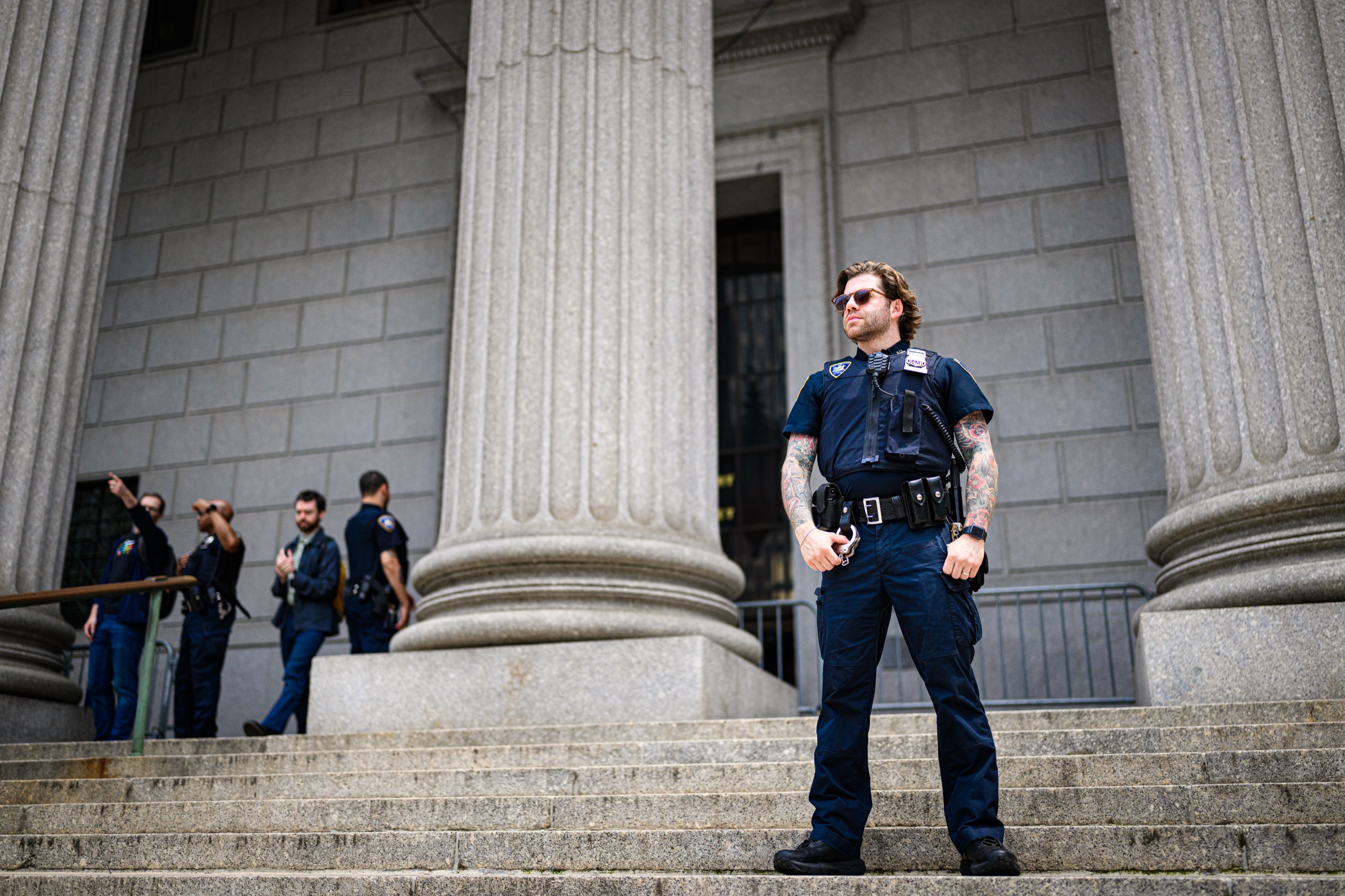A New York City police officer on the courthouse steps